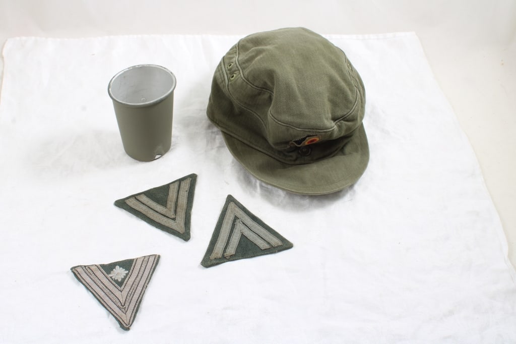 3 WW2 German Luftwaffe Patches, Field Cap, Cup: 3 WW2 German Luftwaffe Patches, Field Cap, Cup - 3 WW2 German Luftwaffe Chevron Uniform Patches, German Field Cap with Insignia and Canteen Cup 1 Lb. Lot Size 8" x 8" x 5". Photos are part of