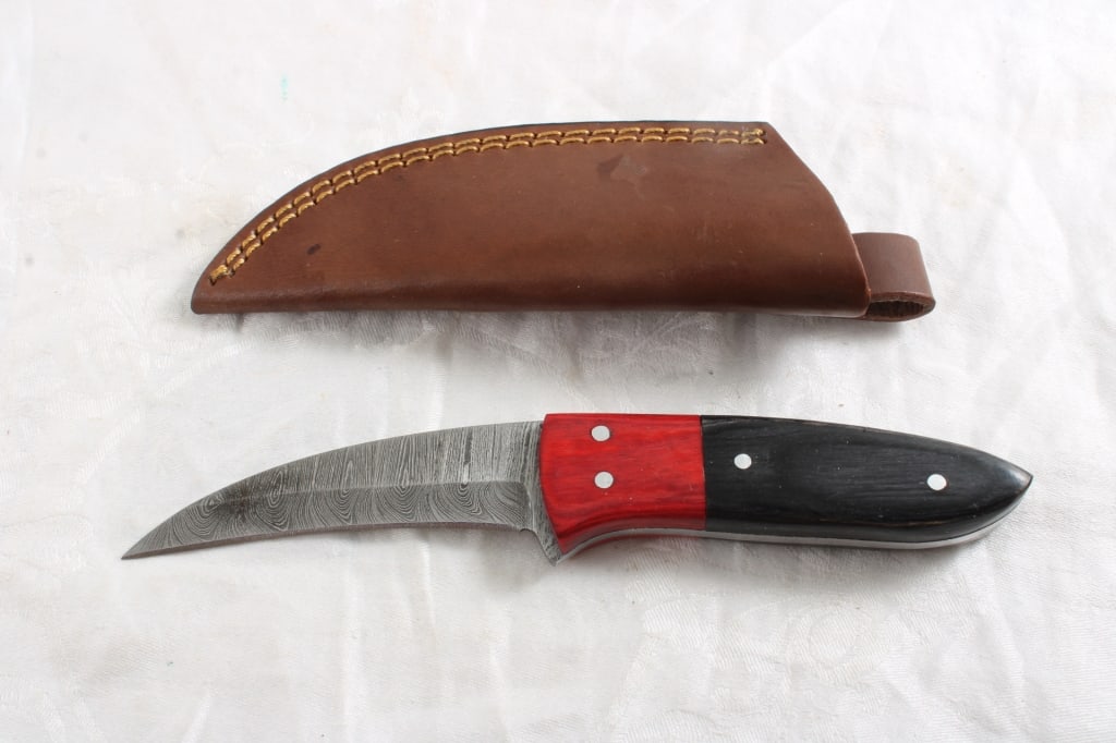 Custom Made Damascus Fixed Blade Knife w/Sheath: Custom Made Damascus Fixed Blade Knife w/Sheath - 8 Oz. Lot Size 8" x 3" x 2". Photos are part of description (Live Auctioneers only shows up to 20). Please ask questions and read terms & conditions