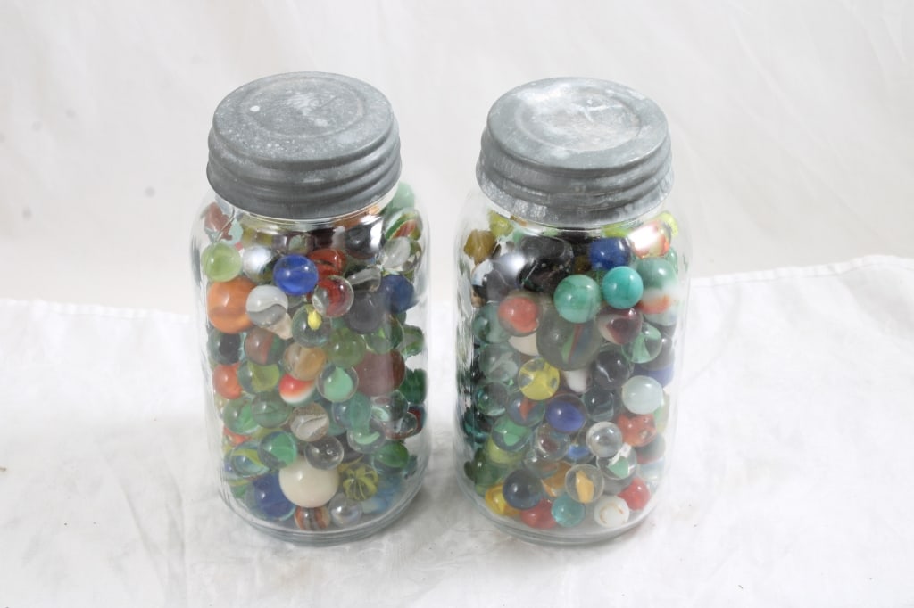 2 Quart Canning Jars of Marbles with Zinc Lids: 2 Quart Canning Jars of Marbles with Zinc Lids - Vintage marbles includes some shooters. 9 Lbs. Lot Size 8" x 8" x 8". Photos are part of description (Live Auctioneers only shows up to 20).