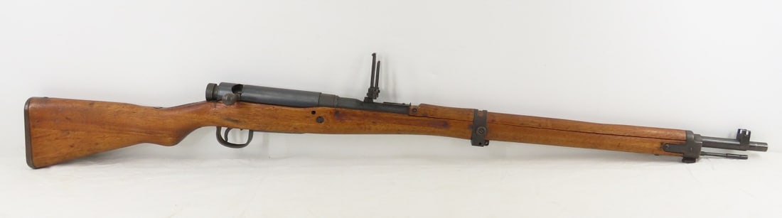 Type 99 Arisaka Model of 1939 Rifle 7.7mm: Type 99 Arisaka Model of 1939 Rifle 7.7mm - SN#25668 Toyo Kogyo Arsenal, 32nd series, scrubbed mum, 26" barrel, bolt action with dust cover, rear anti-aircraft sight, front sight, cleaning rod, sling