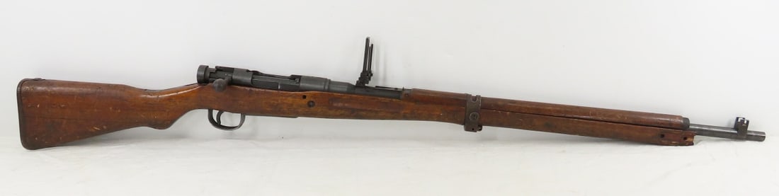 Early Type 99 Arisaka Model of 1939 Rifle 7.7mm: Early Type 99 Arisaka Model of 1939 Rifle 7.7mm - SN#4216 Toyo Kogyo Arsenal, 22nd series, mum is crossed out, 26" barrel, bolt action, rear anti-aircraft sight, front sight, sling mounts, wood stock.