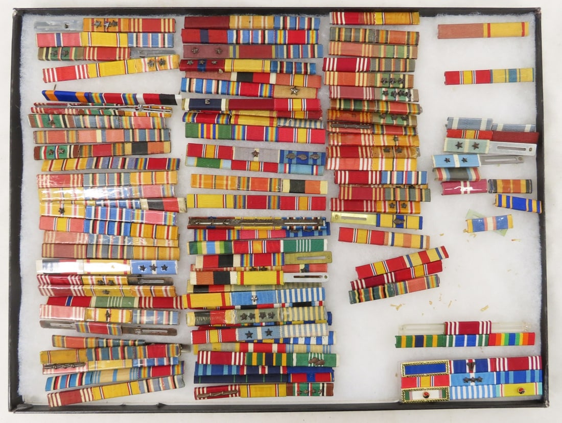 Collection of US Military Ribbon Bars: Collection of US Military Ribbon Bars - Riker case measures 12x16x1" cracked/taped glass - insignia can be shipped without case to save shipping charges. Lot size 12x16x1" 4lb Photos are part of