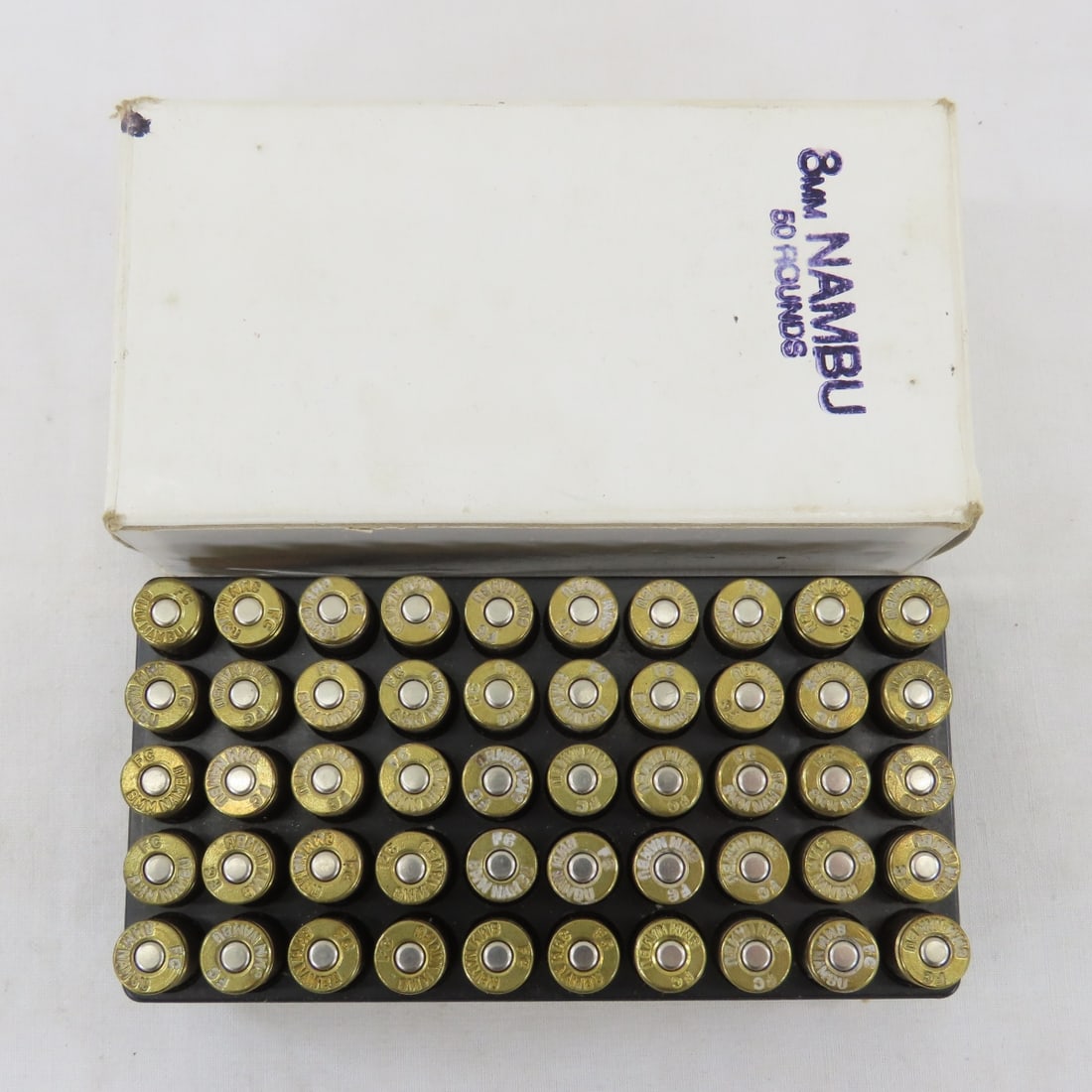 50 Rounds Vintage Japanese 8mm Nambu Ammunition: 50 Rounds Vintage Japanese 8mm Nambu Ammunition - Post WWII 1904-1945. Lot Size: 5 x 3 x 2", 1 lb Photos are part of description. Live Auctioneers displays a max of 20 photos- all photos can be seen
