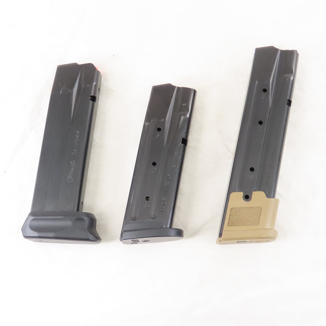 2 Sig Sauer & 1 Walther 9mm Magazines: 2 Sig Sauer & 1 Walther 9mm Magazines - Sig Sauer 9mm (15), Sig Sauer 9mm M18 (21), Walther 9mm (15). Lot size: 6 x 6 x 6", 1 lb. Photos are part of description. Live Auctioneers displays a max of