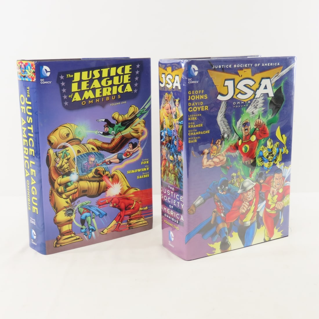 Justice League America Omnibus Vol 1 & JSA Vol 2: Justice League America Omnibus Vol 1 & JSA Vol 2 - Lot Size 12x8x6" 15lb Photos are part of description. Max of 20 photos are shown in Live Auctioneers, all are shown on Proxibid and