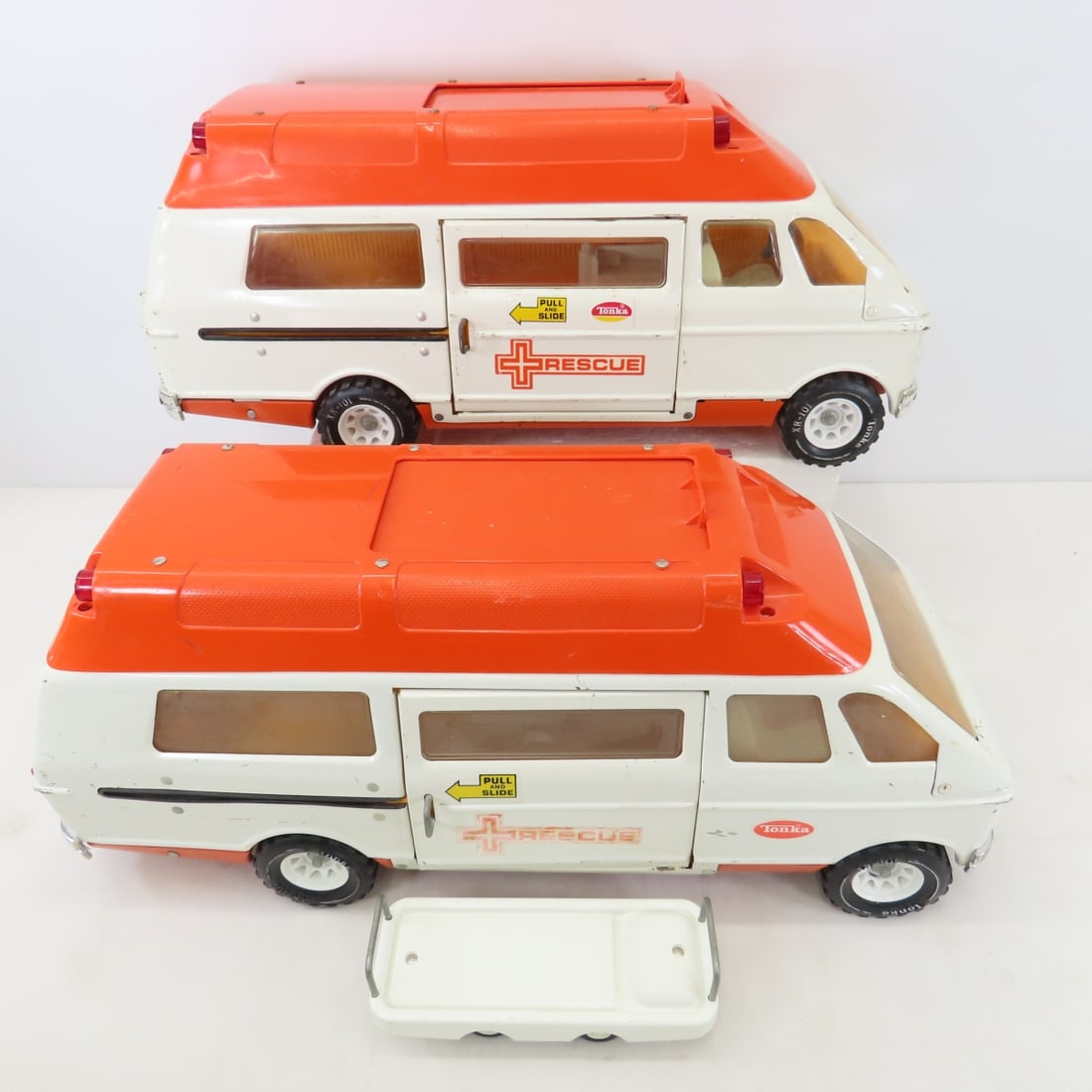 1975-76 & 1978 Mighty Tonka Rescue Ambulances: 1975-76 & 1978 Mighty Tonka Rescue Ambulances - with 1 gurney. 1975-76 is missing one chair in back of van. lot size: 19x15x10", 13 lbs Photos are part of description. Max of 20 photos are shown in Li