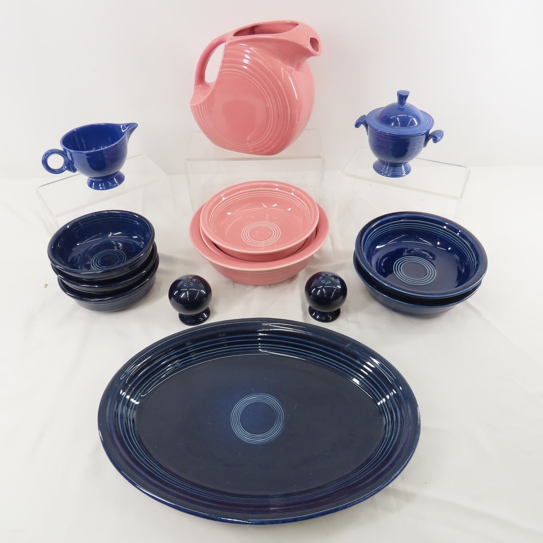 Rose & Cobalt Fiestaware Dishes: Rose & Cobalt Fiestaware Dishes - Rose pitcher, 8.5" bowl, 2 7" bowls. Blue- not quite cobalt- creamer & sugar with lid. Cobalt: 2 7" bowls, 3 5.5" bowls, 13.5" platter, and salt & pepper. No chips or