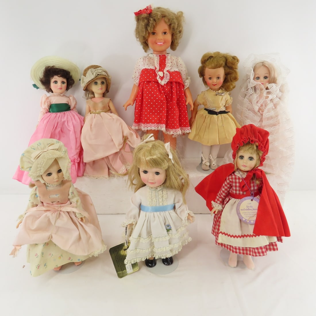 2 Shirley Temple & 6 Effanbee Plastic Dolls: 2 Shirley Temple & 6 Effanbee Plastic Dolls - 1972 Ideal vinyl 16" Shirley, 12" Ideal vinyl Shirley, 11" Friday Effanbee day by day doll- original clothes, and 5 12" plastic Effanbee. All with