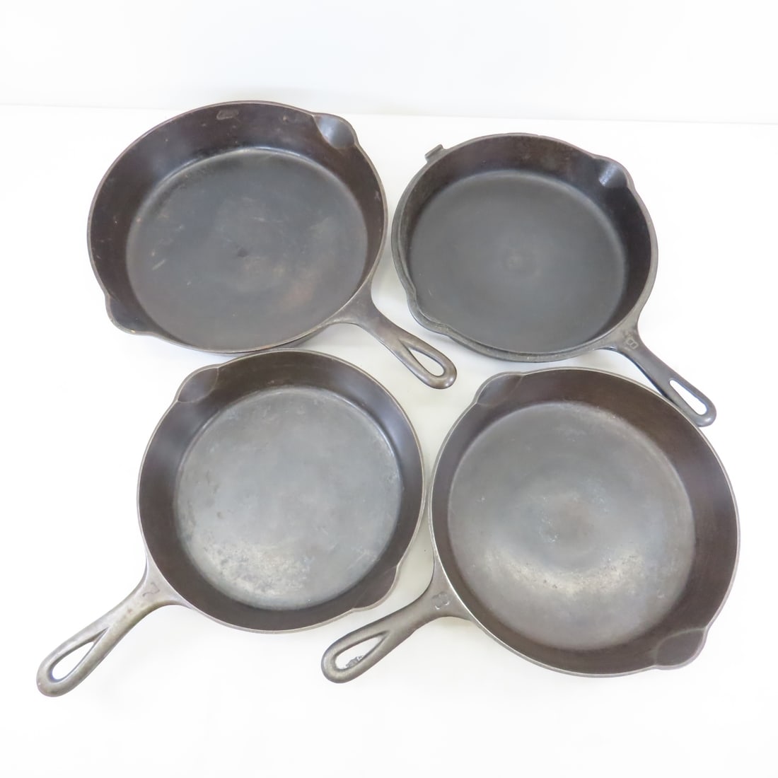 Griswold Cast Iron Skillets #7, #8(2) & #10: Griswold Cast Iron Skillets #7, #8(2) & #10 - #7 (701 D) 9", #8 (704 B &1103 A) 10", #10 (716 A) 10", Erie, PA. Lot Size: 17 x 13 x 7", 18 lbs Photos are part of description. (Live Auctioneers