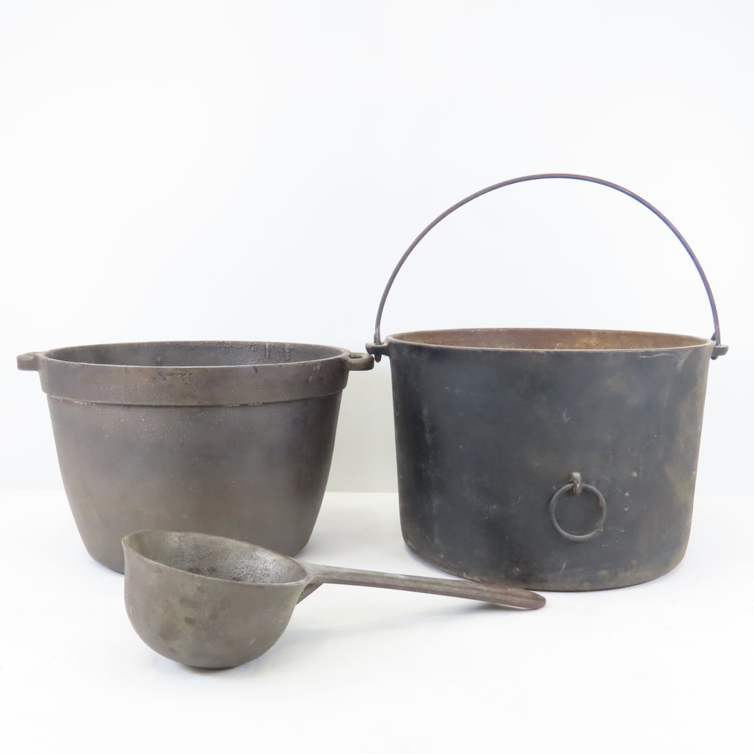 Vintage Wagner Cast Iron Cauldron, Pot & Ladle: Vintage Wagner Cast Iron Cauldron, Pot & Ladle - Wagner Cauldron 10", Unbranded Pot 9", H. Kohnstamm & Co. Smelting Ladle. Lot Size: 12 x 12 x 9", 20 lbs Photos are part of description. (Live