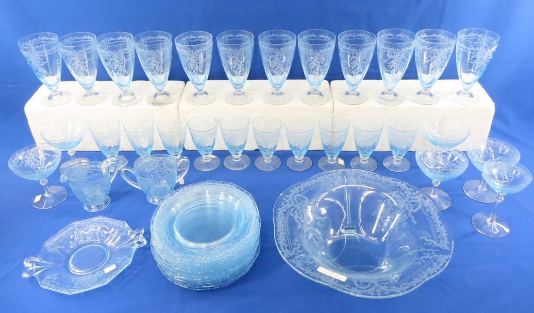 Fostoria June Pattern Dishes in Blue: Fostoria June Pattern Dishes in Blue - 12 6" glasses, 5 4.5" champagne glasses, 10 4.5 glasses, 1 5.25" glass, sugar & creamer, 12 7.5" plates, 12" footed bowl, 1 8.25" handled under plate. No