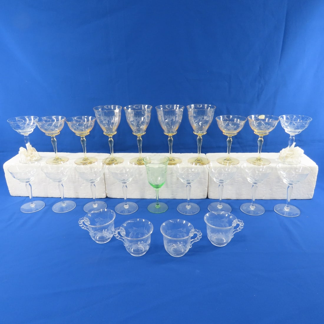 Antique Etched Floral Glassware: Antique Etched Floral Glassware - 1 green 7" glass, 10 6" clear champagne glasses- 2 with flowers, 4 6" and 4 7.5" matching yellow glasses, 4 clear coffee cups. Lot size: 20x16x6", 8.5 lbs Photos