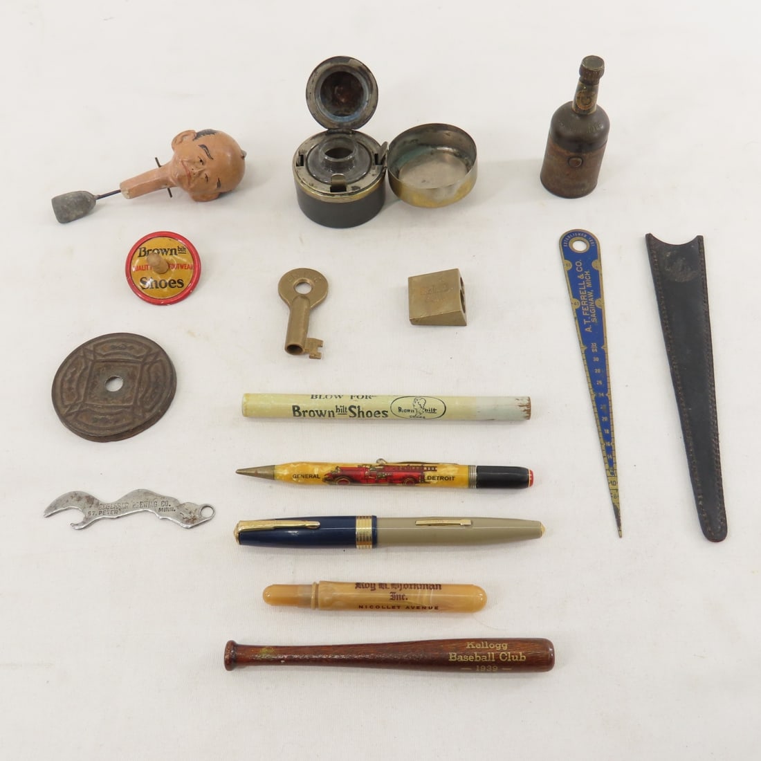 Victorian Ink Wells, Advertising, BN Key & More: Victorian Ink Wells, Advertising, BN Key & More - Burlington Northern key, brown shoes top & whistle, imperial penM&R brass pencil sharpener, and more. Lot size 9x7x5", 1 lb Photos are part of