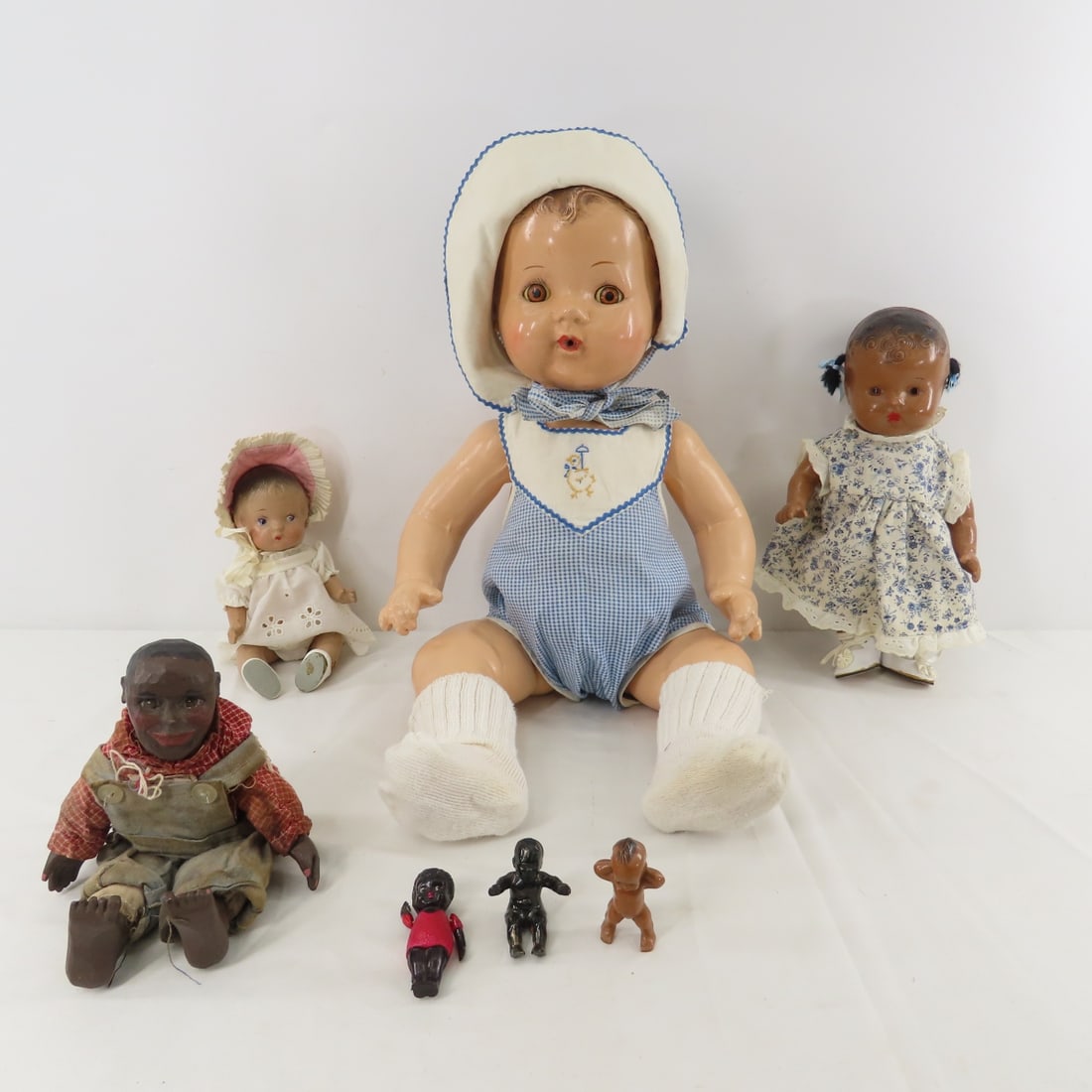 Compo Drink & Wet and Other Dolls: Compo Drink & Wet and Other Dolls - 1) 18" unmarked drink & wet compo baby doll with molded hair and sleepy eyes. 2) 10" unmarked black compo has cracked head and torso. 3) 7" unmarked compo baby- dam