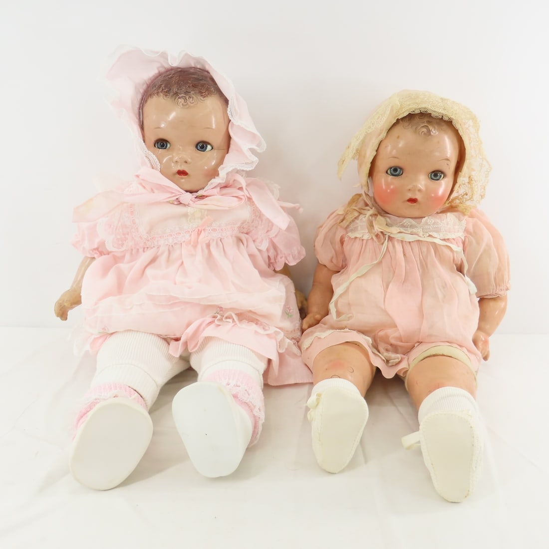 2 Antique Ideal Composition & Cloth Baby Dolls: 2 Antique Ideal Composition & Cloth Baby Dolls - Both are 22" have compo heads, arms and legs with cloth body, sleep eyes, molded hair, closed mouths and not working criers. Small cracks and