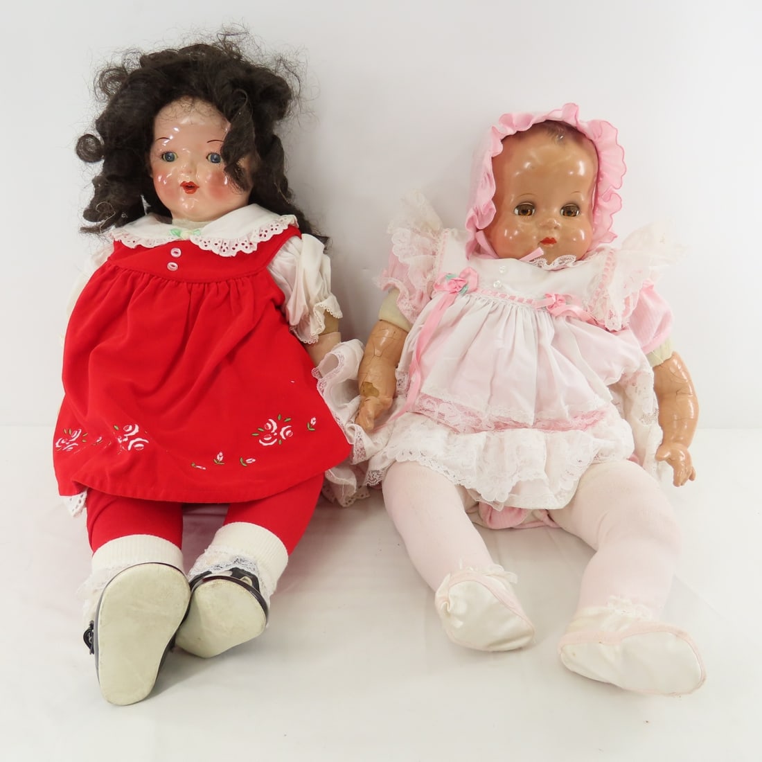 2 Antique Ideal Composition & Cloth Baby Dolls: 2 Antique Ideal Composition & Cloth Baby Dolls - 1) 24" molded hair, sleep eyes with lashes, closed mouth, crier not working. Some crazing. 2) 24" jointed cloth body and legs, arms have replaced