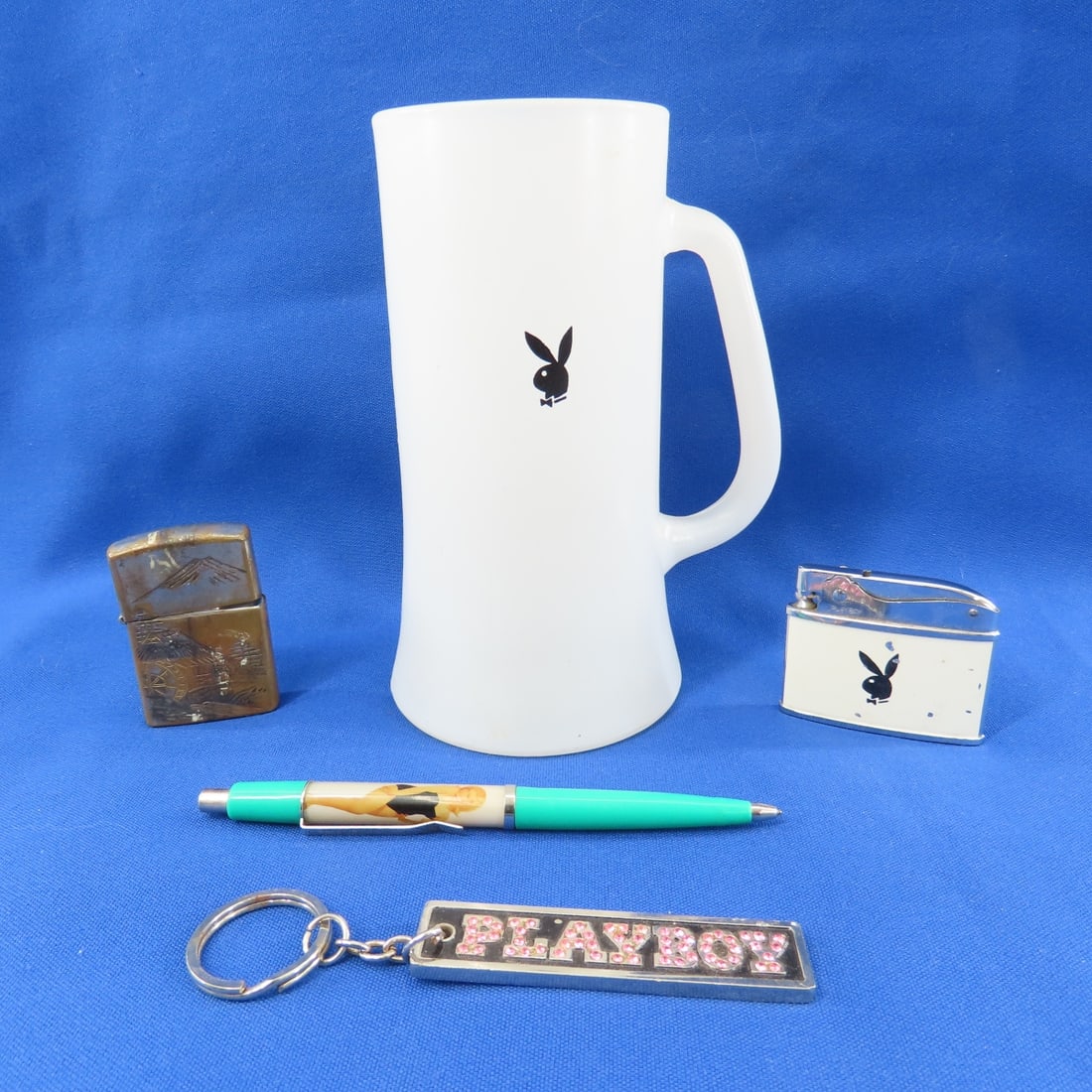 Playboy Mug, Stripper Pen, Lighters & Keychain: Playboy Mug, Stripper Pen, Lighters & Keychain - LOT SIZE 8X6X4" 2 LB Photos are part of description. (Live Auctioneers only shows a max of 20 photos). Please ask questions and read terms &