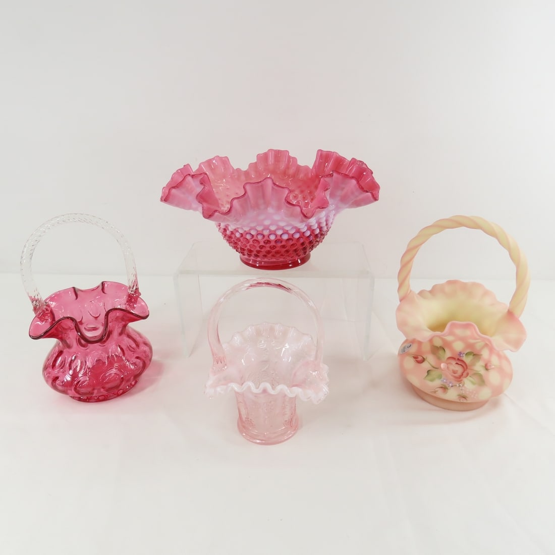 3 Fenton Glass Baskets and 1 Ruffle Bowl: 3 Fenton Glass Baskets and 1 Ruffle Bowl - Bowl measures approx 9.5x4.5". LOT SIZE 12X12X12" 5 LB Photos are part of description. (Live Auctioneers only shows a max of 20 photos). Please ask