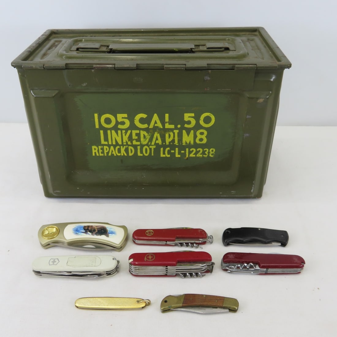 Military .50 Cal Ammo Can & 8 Folding Knives: Military .50 Cal Ammo Can & 8 Folding Knives - lot size: 20x12x6", 6.4 lbs Photos are part of description. (Live Auctioneers only shows a max of 20 photos). Please ask questions and read terms &