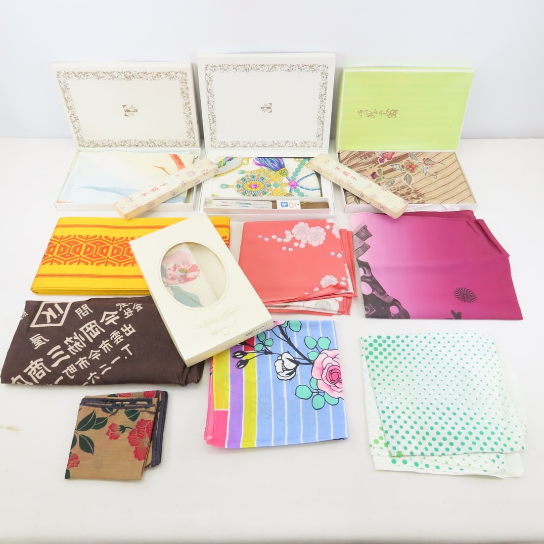 Japanese Takashimaya Scarves, Fabrics & Fans: Japanese Takashimaya Scarves, Fabrics & Fans - other Japanese brands, some new in box, 1 kimono belt, 3 fans, and more. Lot size: 14x8x8", 4 lbs Photos are part of description. (Live Auctioneers