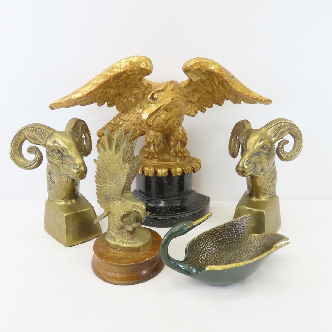 Brass Ram Bookends, Eagle Sculptures & More: Brass Ram Bookends, Eagle Sculptures & More - unmarked bookends, Borghese Eagle- half of bookend set is gilded wood, brass eagle sculpture, and Pal-Dell Co Israeli brass swan dish. Large Eagle has