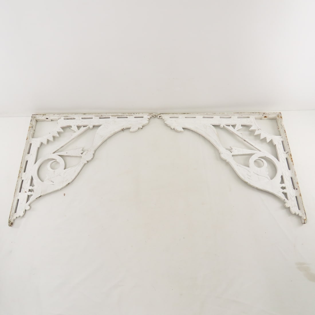 Pair of Antique Cast Iron Decorative Corbels: Pair of Antique Cast Iron Decorative Corbels - measures 18x16". Lot sie: 18x16x4", 14 lbs Photos are part of description. (Live Auctioneers only shows a max of 20 photos). Please ask questions and