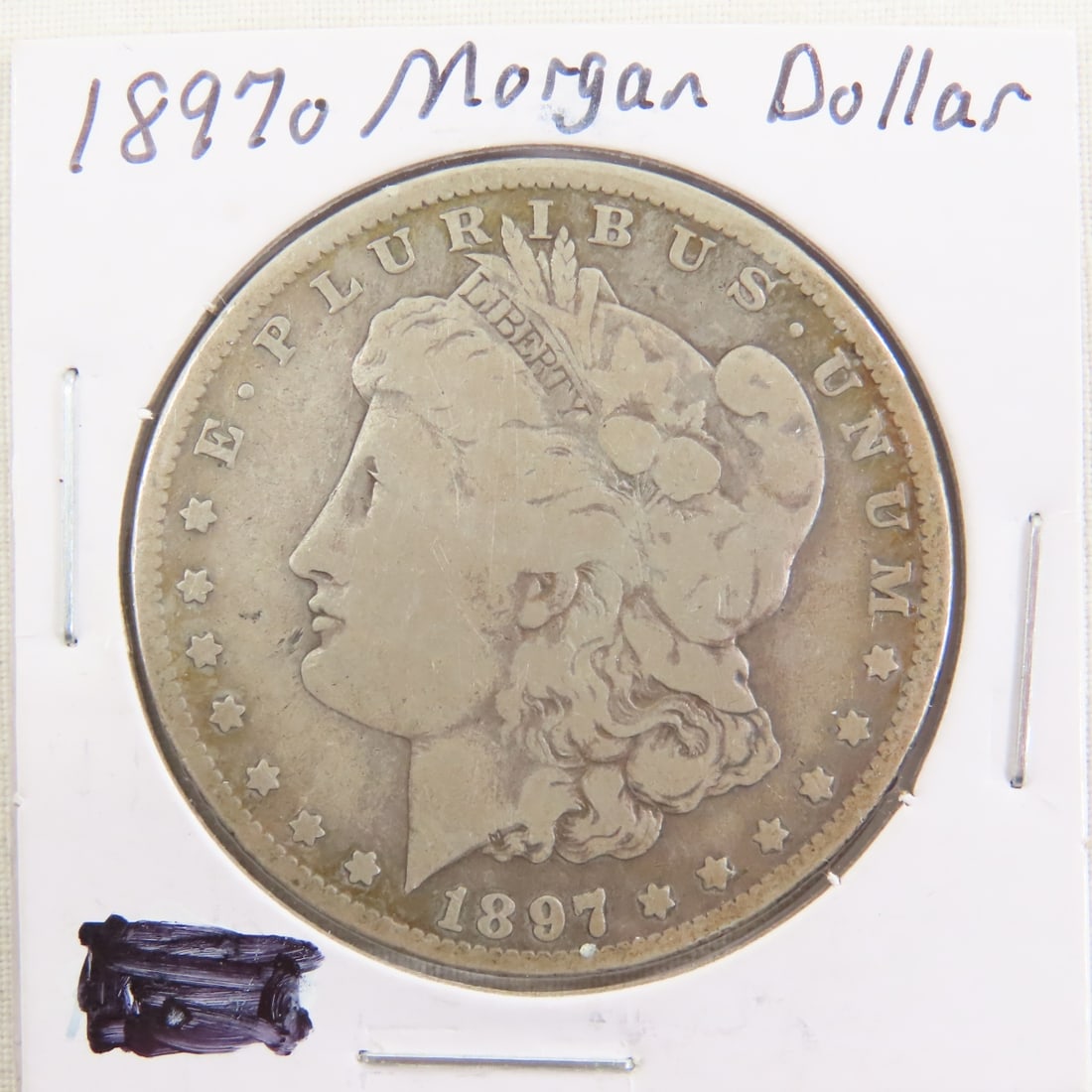 1897 O Morgan Silver Dollar: 1897 O Morgan Silver Dollar - Lot Size 3x3x3" 1 LB Photos are part of description. (Live Auctioneers only shows a max of 20 photos). Please ask questions and read terms & conditions before bidding. 