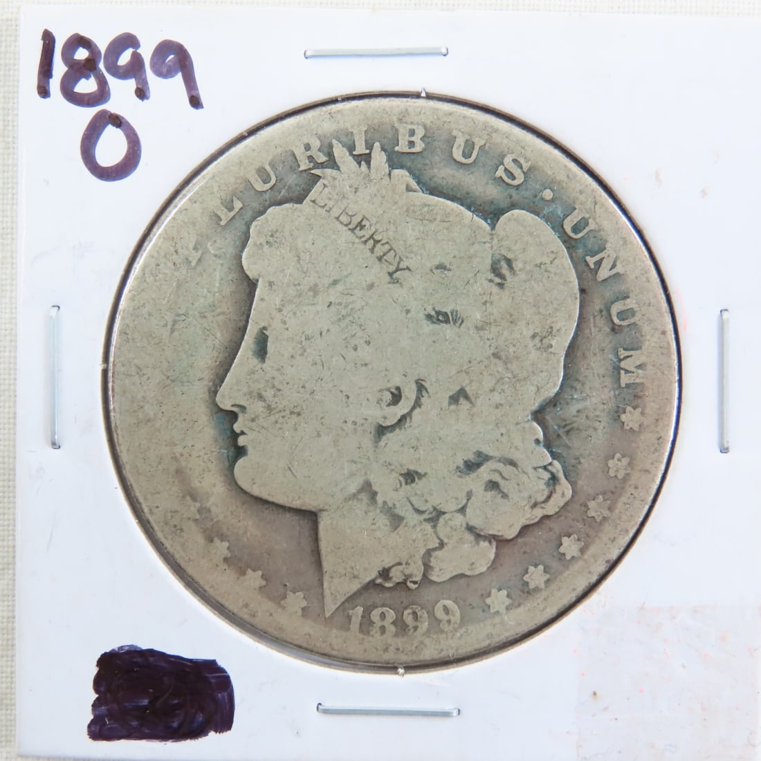 1899 O Morgan Silver Dollar: 1899 O Morgan Silver Dollar - Lot Size 3x3x3" 1 LB Photos are part of description. (Live Auctioneers only shows a max of 20 photos). Please ask questions and read terms & conditions before bidding. 