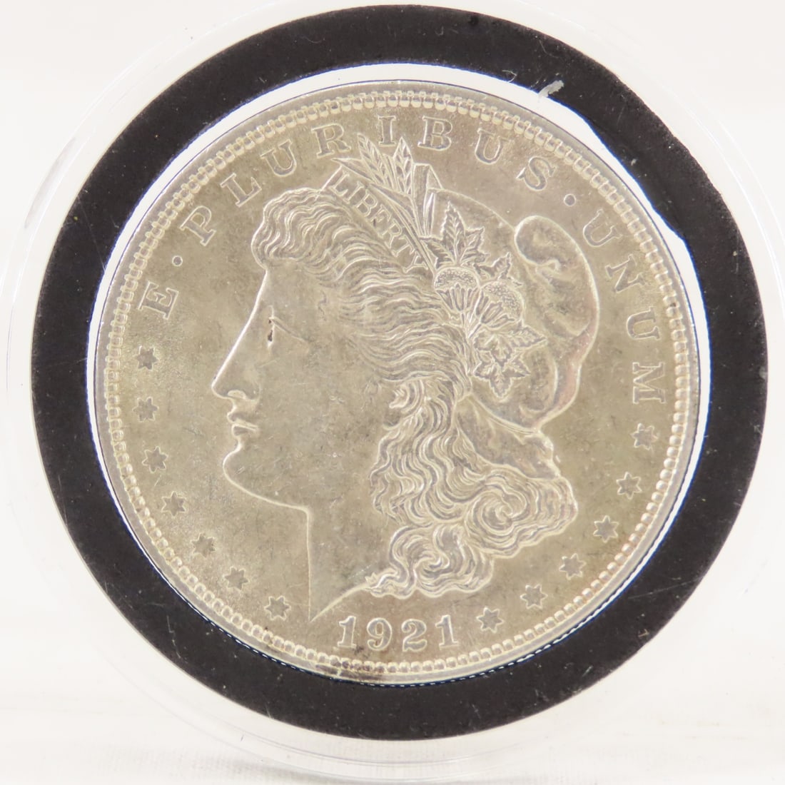 1921 Morgan Silver Dollar: 1921 Morgan Silver Dollar - Lot Size 3x3x3" 1 LB Photos are part of description. (Live Auctioneers only shows a max of 20 photos). Please ask questions and read terms & conditions before bidding. 