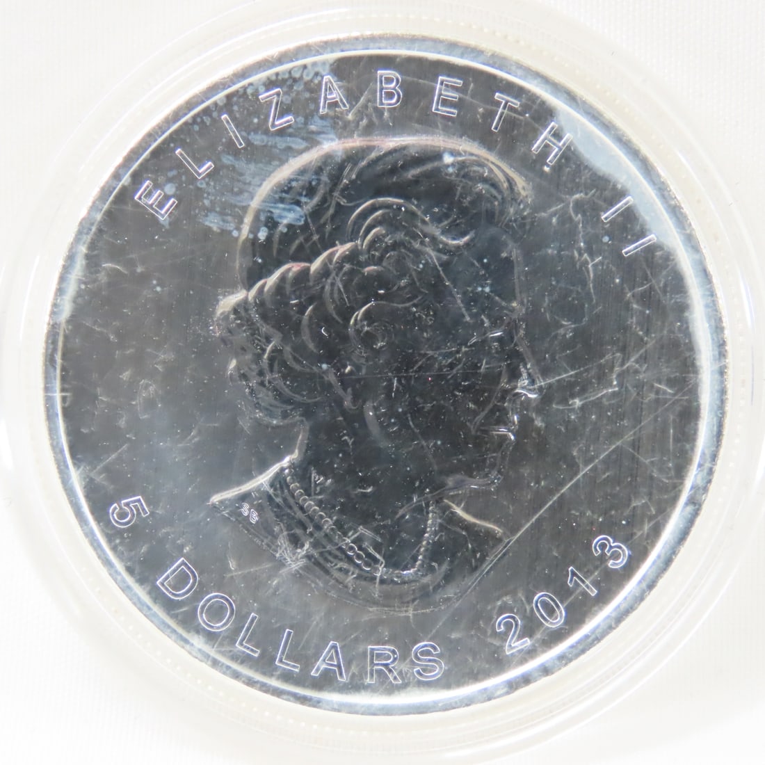 2013 Canadian $5 1 ozt .9999 Silver Coin: 2013 Canadian $5 1 ozt .9999 Silver Coin - Lot Size 3x3x3" 1 LB Photos are part of description. (Live Auctioneers only shows a max of 20 photos). Please ask questions and read terms & conditions