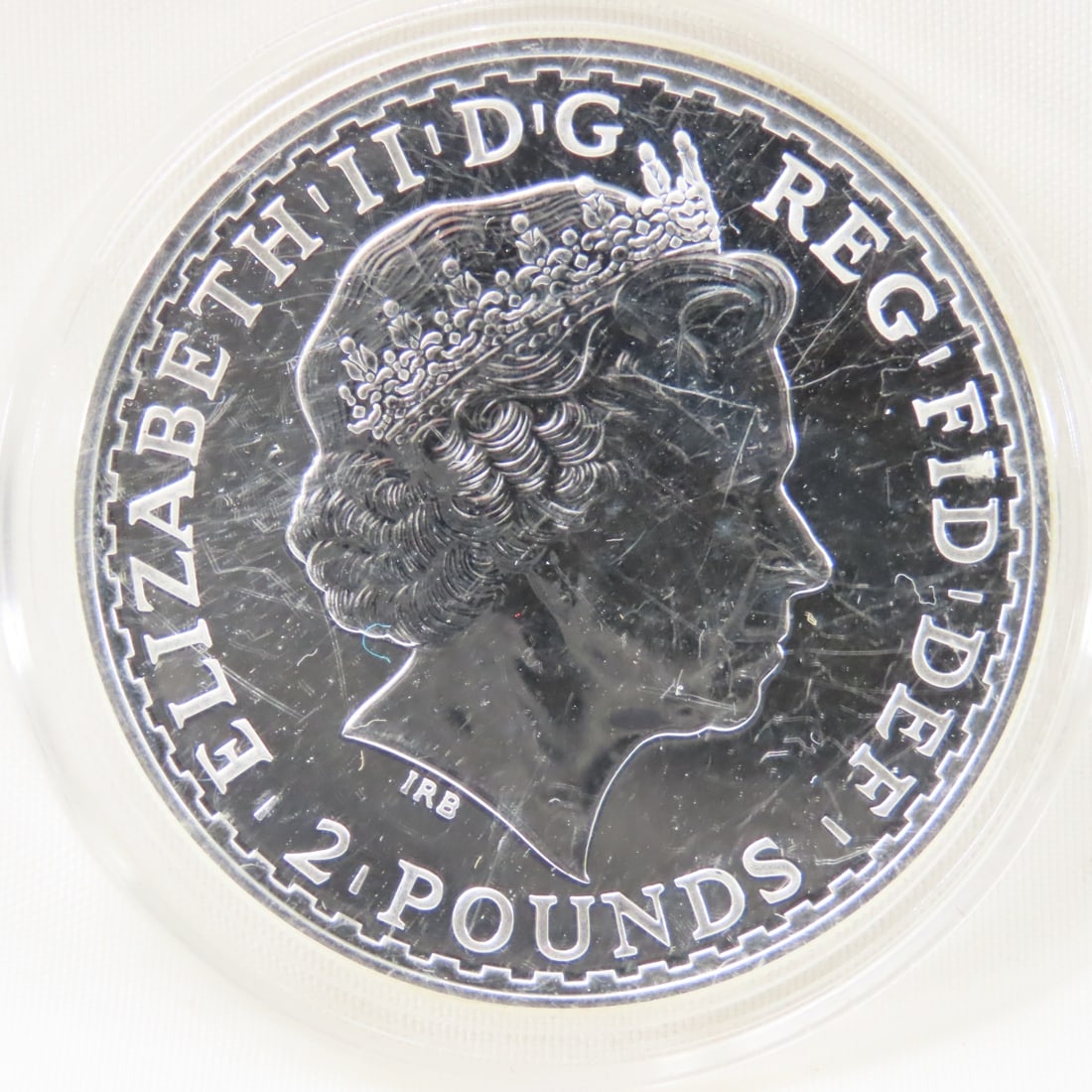 2013 Brittania 2 Pounds 1 ozt .999 Silver Coin: 2013 Brittania 2 Pounds 1 ozt .999 Silver Coin - Lot Size 3x3x3" 1 LB Photos are part of description. (Live Auctioneers only shows a max of 20 photos). Please ask questions and read terms &
