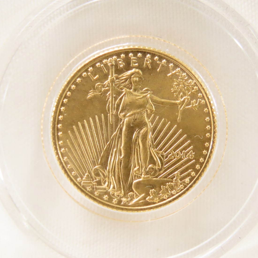 2014 1/10 ozt .999 Gold American Eagle: 2014 1/10 ozt .999 Gold American Eagle - Lot Size 3x3x3" 1 LB Photos are part of description. (Live Auctioneers only shows a max of 20 photos). Please ask questions and read terms & conditions before
