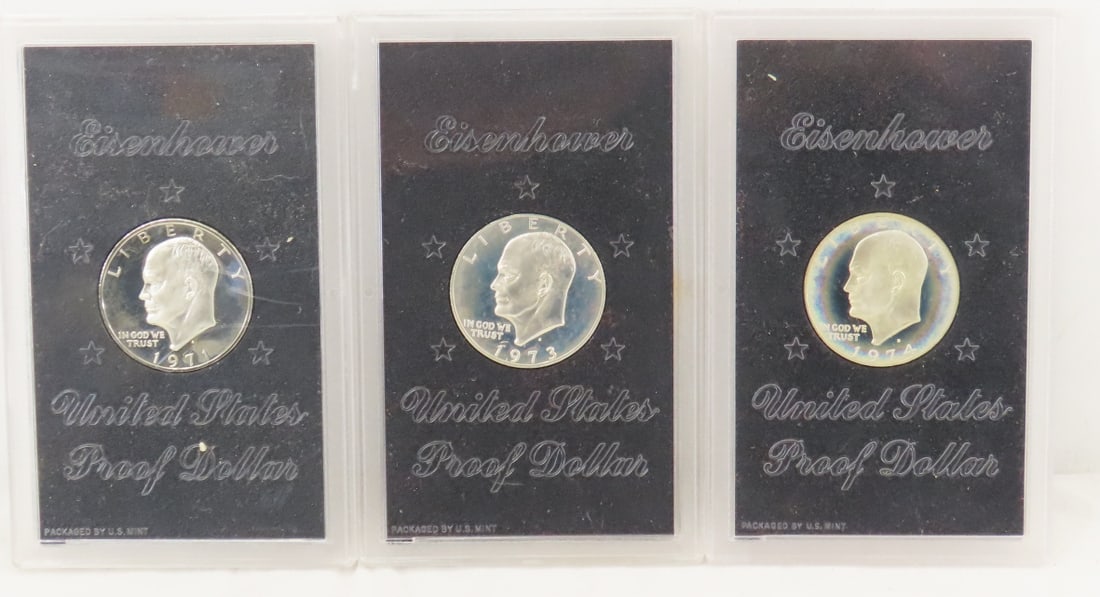 1971, 1973, 1974 Silver Eisenhower Proof Dollars: 1971, 1973, 1974 Silver Eisenhower Proof Dollars - in plastic cases, no brown boxes. LOT SIZE 4x6x3" 2 LB Photos are part of description. (Live Auctioneers only shows a max of 20 photos). Please ask