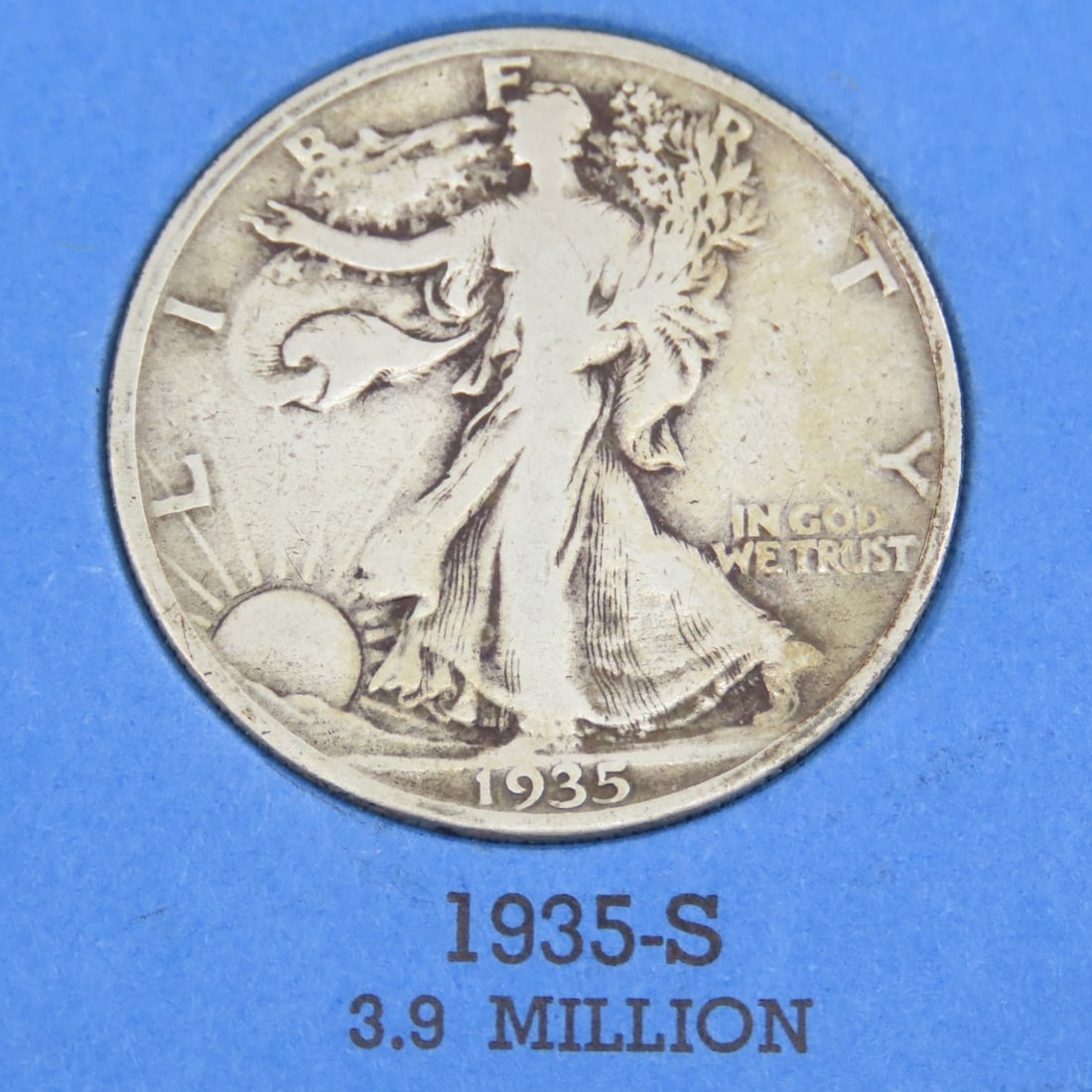 8 Walking Liberty Silver Half Dollars in books - 8