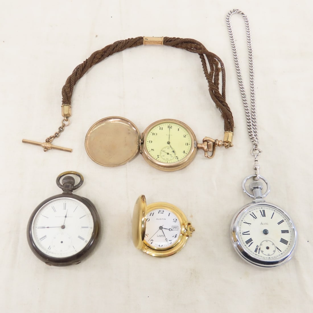 4 Pocket Watches & Hair Fob for Parts: 4 Pocket Watches & Hair Fob for Parts - 1) Austin 17 jewel incabloc with date, 2) 1883 Elgin 11 jewel, 16s, open face with bezel glass, no hands, open face SN# 1128399, with braided hair fob- has