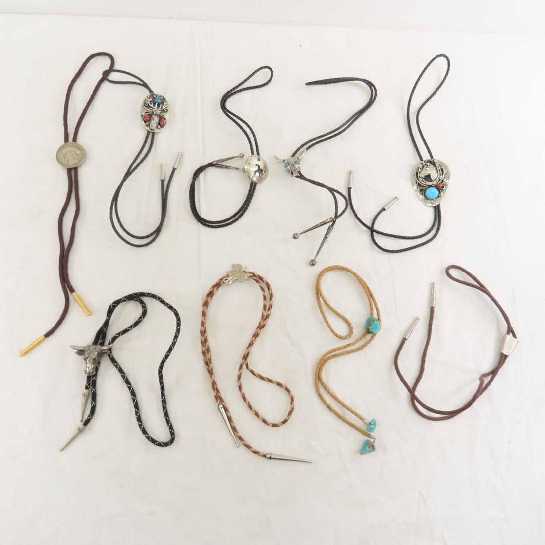 Collection of Bolo Ties: Collection of Bolo Ties - Lot Size 5x5x5" 2 LB Photos are part of description. (Live Auctioneers only shows a max of 20 photos). Please ask questions and read terms & conditions before bidding. 