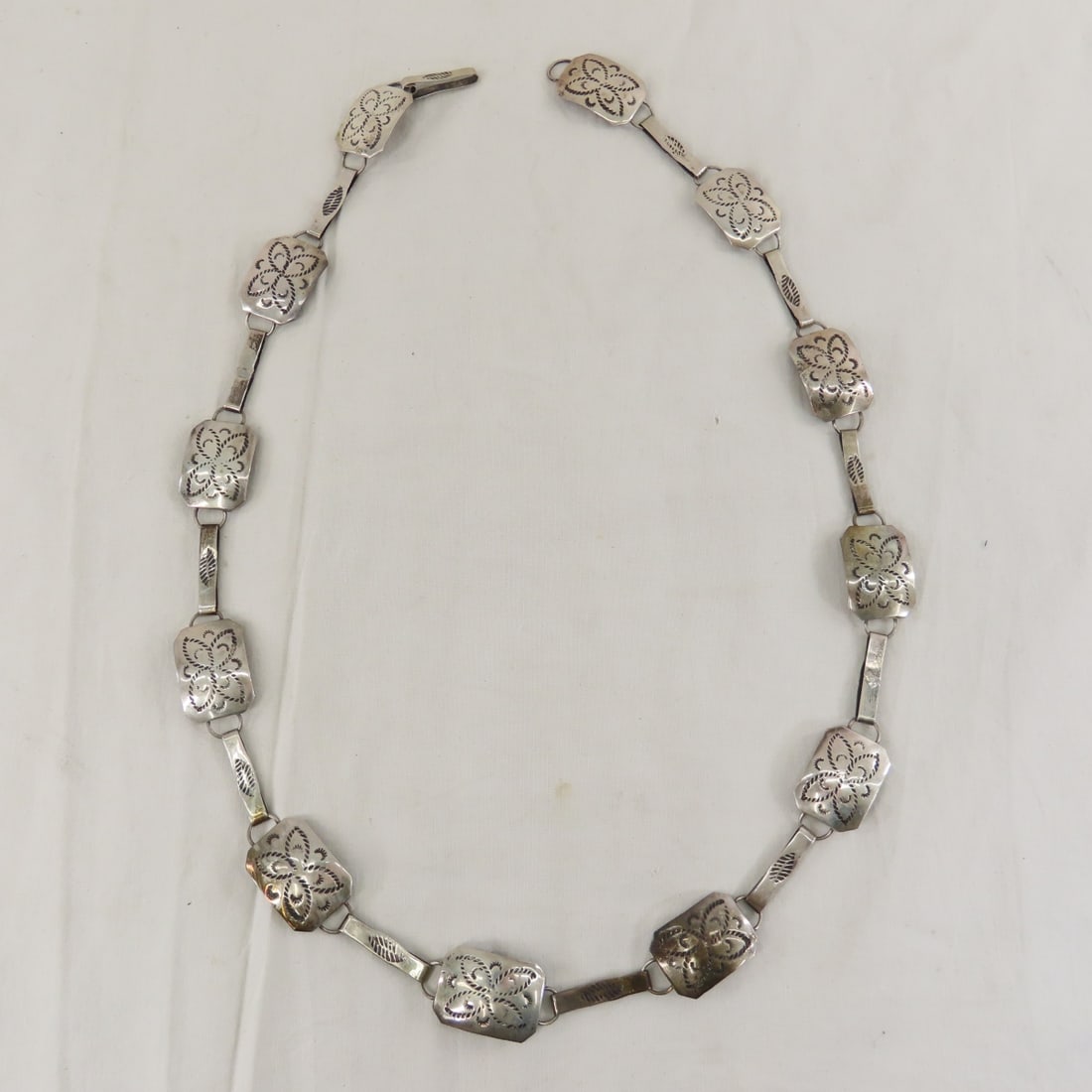 Hand Tooled Sterling Silver Belt, 32", 67 grams: Hand Tooled Sterling Silver Belt, 32", 67 grams - Lot size: 8x3x3" 3 oz Photos are part of description. (Live Auctioneers only shows a max of 20 photos). Please ask questions and read terms & conditio