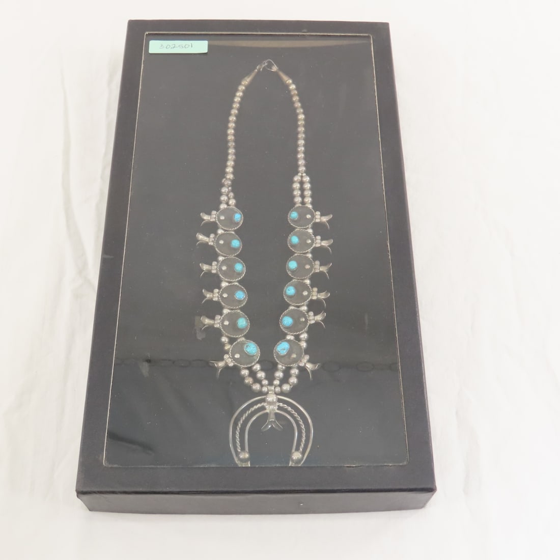 American Indian Squash Blossom Necklace: American Indian Squash Blossom Necklace - unmarked silver and turquoise, 123.8gr total weight. in riker case. Lot size:14.5x8x2", 1.7 lbs Photos are part of description. (Live Auctioneers only