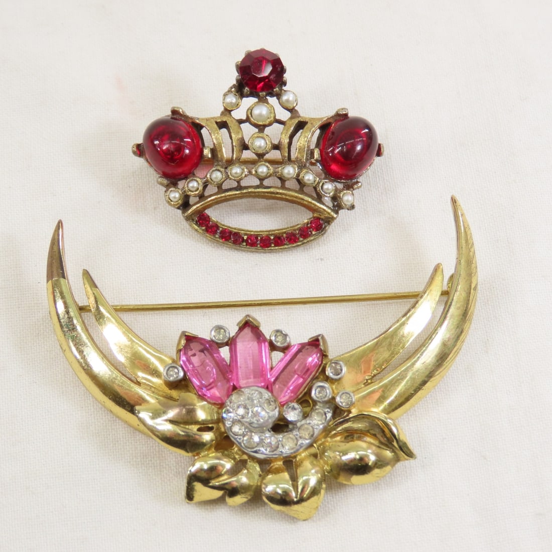 Vintage Crown & Floral Crescent Brooches: Vintage Crown & Floral Crescent Brooches - both unmarked, no missing stones. Lot size: 3x3x2", 1.2 oz Photos are part of description. (Live Auctioneers only shows a max of 20 photos). Please ask