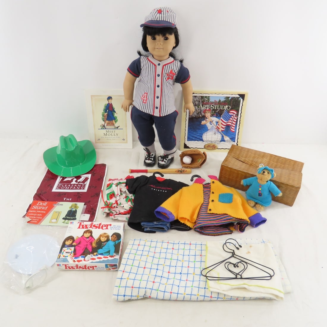 American Girl of Today #4 Asian Doll 749/76: American Girl of Today #4 Asian Doll 749/76 - Pleasant Company 18" doll in good condition, 4 outfits, hats, shoes, bear, Molly book 1, art studio book, Twister game, bag, stand, and more. Lot