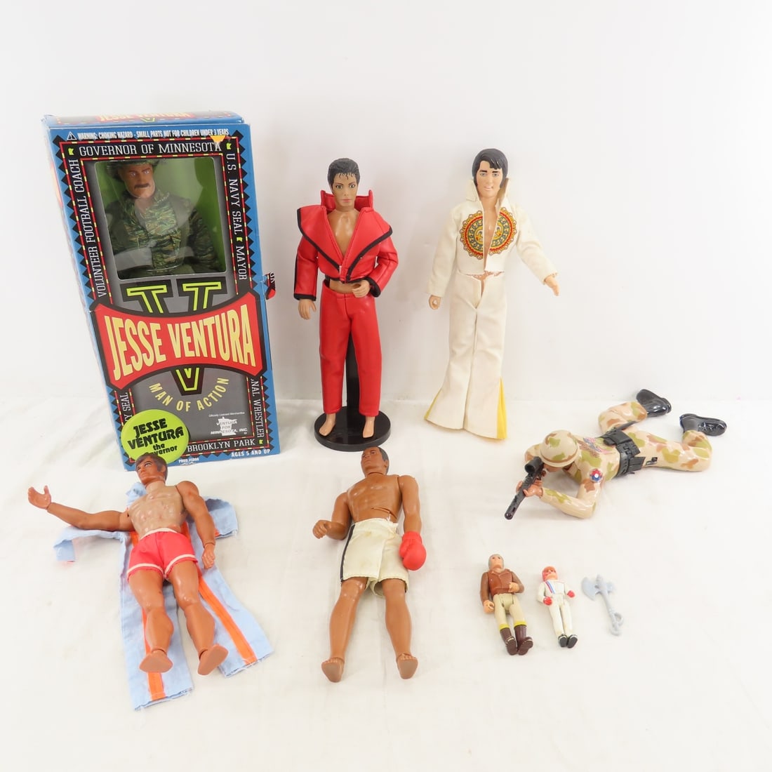 Big Jim, Ali, Ventura, Elvis & Other Figures: Big Jim, Ali, Ventura, Elvis & Other Figures - Karate Chop Big Jim and extra jumpsuit. 1975 MEGO Muhammad Ali the champ- incomplete. 1984 EPNC Inc Elvis, 1987 Regency crawling army figure-