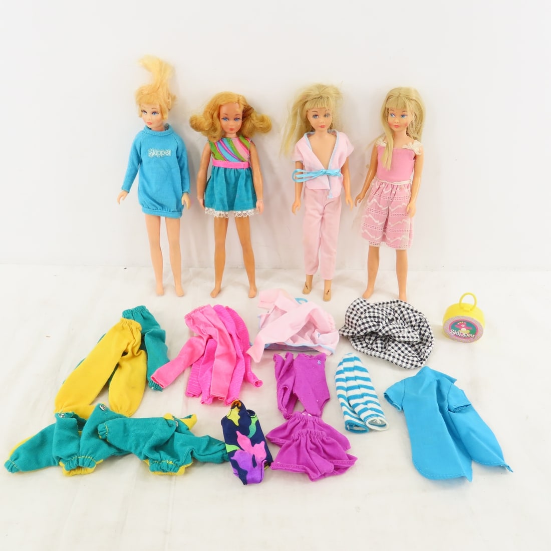 4 Skipper Dolls -1030,1105 (2) & 1117: 4 Skipper Dolls -1030,1105 (2) & 1117 - 1) Blonde Dramatic Living Skipper #1117 marked: "©1969 Mattel, Inc./Taiwan/U.S. & For. Patd./Other Pats.Pend /Patd. in Canada 1967". 2) Blonde #1030 Skippe