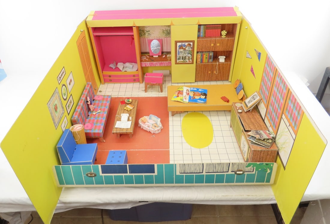 Original 1962 Barbie Dream House: Original 1962 Barbie Dream House - some water stain on inside- many accessories as shown- played with condition. Lot size: 27x16x8", 7 lbs Photos are part of description. (Live Auctioneers only shows