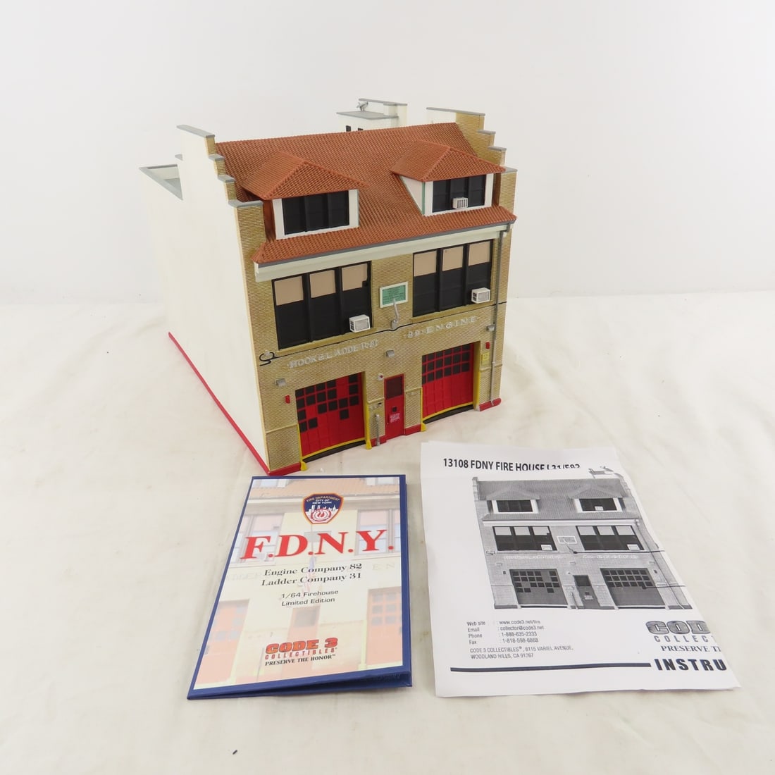 Code 3 Collectibles, F.D.N.Y. 1:64 Scale Firehouse: Code 3 Collectibles, F.D.N.Y. 1:64 Scale Firehouse - 9.5" tall. Lot Size: 13 x 10 x 9", 14 lbs Photos are part of description. (Live Auctioneers only shows a max of 20 photos). Please ask questions