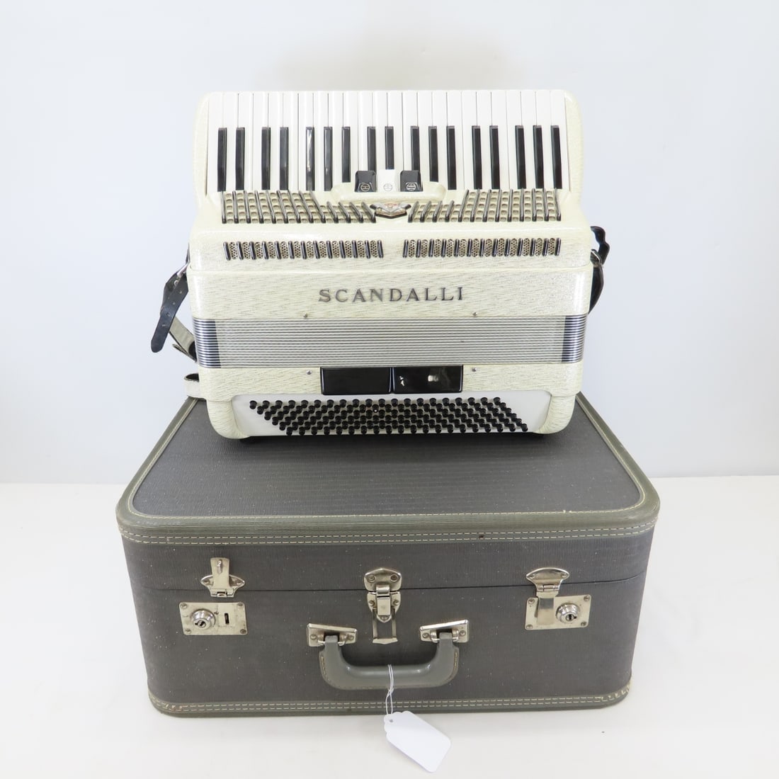 Scandalli Silvana III 24 Piano Key Accordion: Scandalli Silvana III 24 Piano Key Accordion - Custom Built Made in Italy, serial number M905/6. 3 treble switches, bellows are good, works well. In original hard case. Lot size:22x19x10", 28 lbs