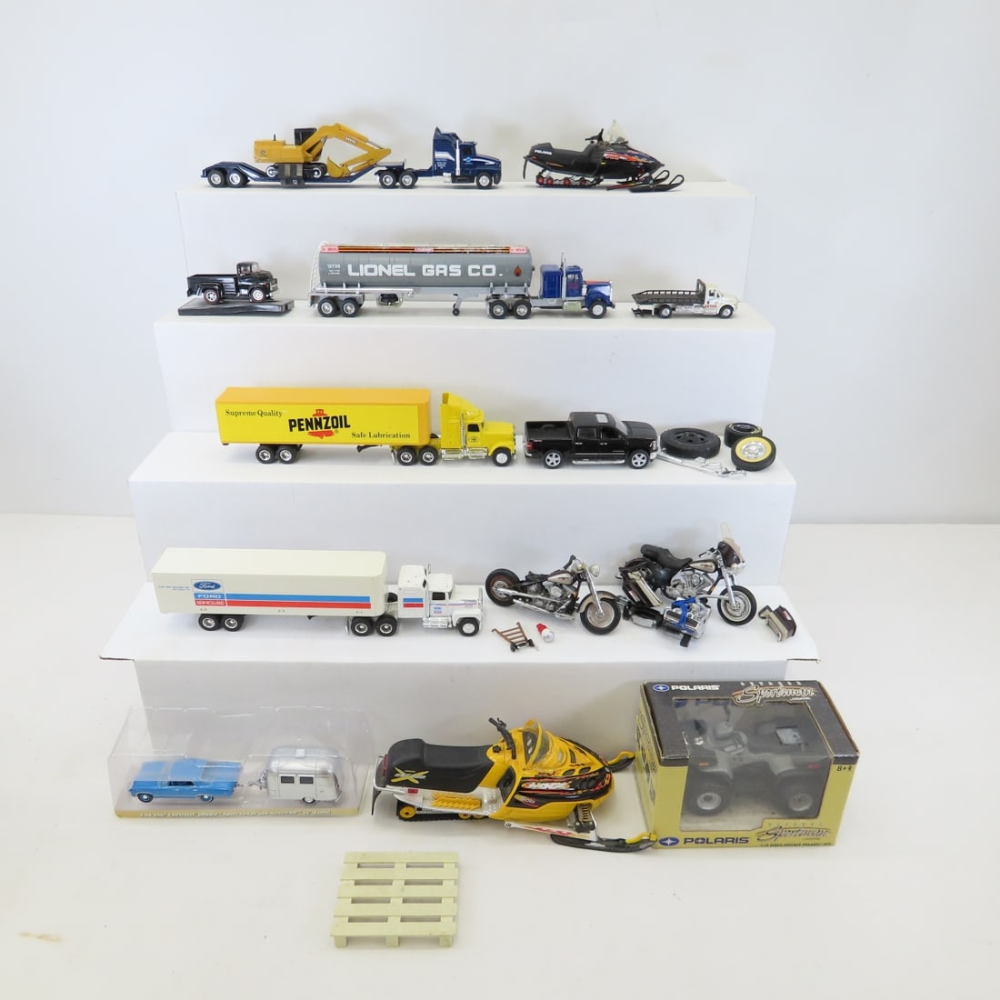 Diecast Motorcycles, Snowmobiles, Semis & More: Diecast Motorcycles, Snowmobiles, Semis & More - Lionel, Ertl, Polaris, Castline, Matchbox, NewRay & other. Lot Size: 16 x 12 x 6", 6 lbs Photos are part of description. (Live Auctioneers only