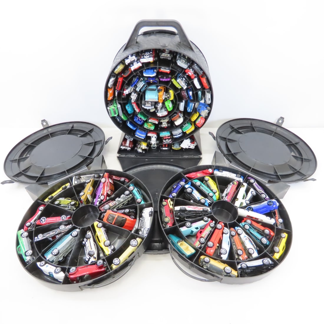 150+ Modern Hot Wheels in Rally & Spinner Cases: 150+ Modern Hot Wheels in Rally & Spinner Cases - Lot Size: 15 x 12 x 12", 20 lbs Photos are part of description. (Live Auctioneers only shows a max of 20 photos). Please ask questions and read terms