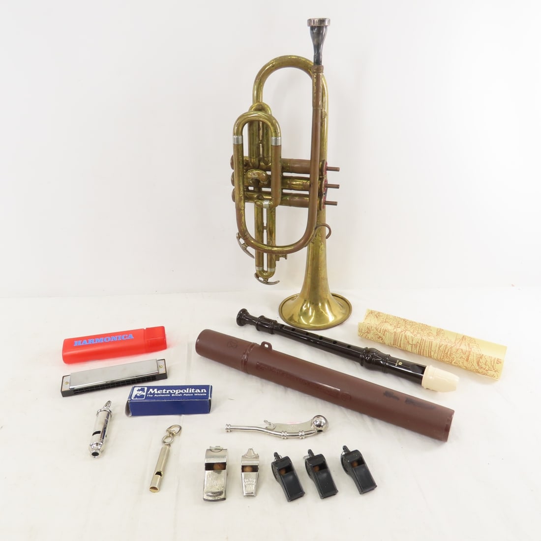 Zen-On Recorder, Trumpet, Harmonica & Whistles: Zen-On Recorder, Trumpet, Harmonica & Whistles - Zen-On Soprano Recorder, Generic Harmonica, American Student Trumpet (missing Keys, broken) Acme, Metropolis & Other Whistles. Lot Size: 17 x 12 x