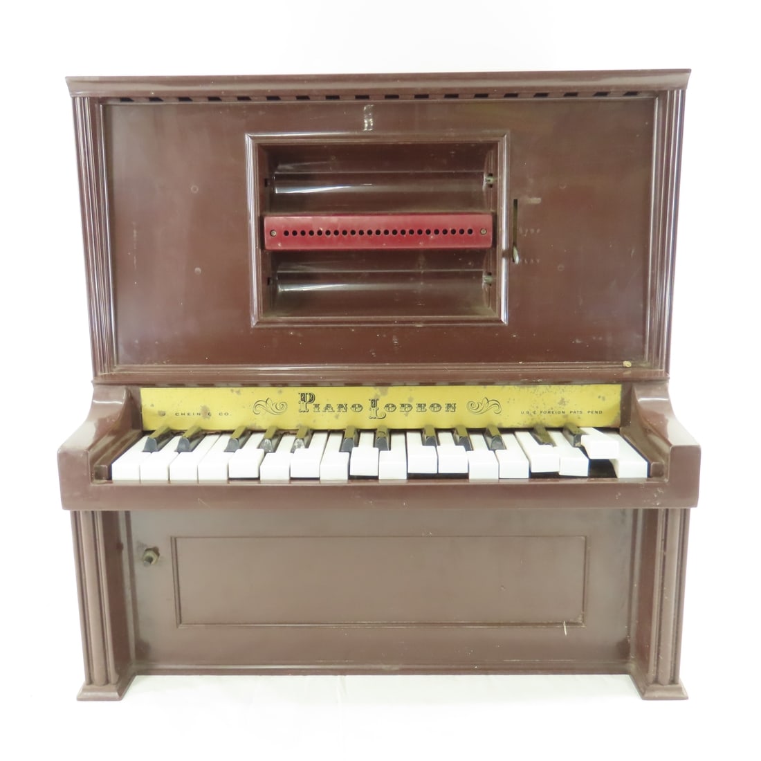 Vintage J. Chein & Co Piano Lodeon: Vintage J. Chein & Co Piano Lodeon - Keys are not perfectly set in place but all manually play notes. Electronics not working, machine hums slightly but doesn't appear to function. Lot Size 20 x