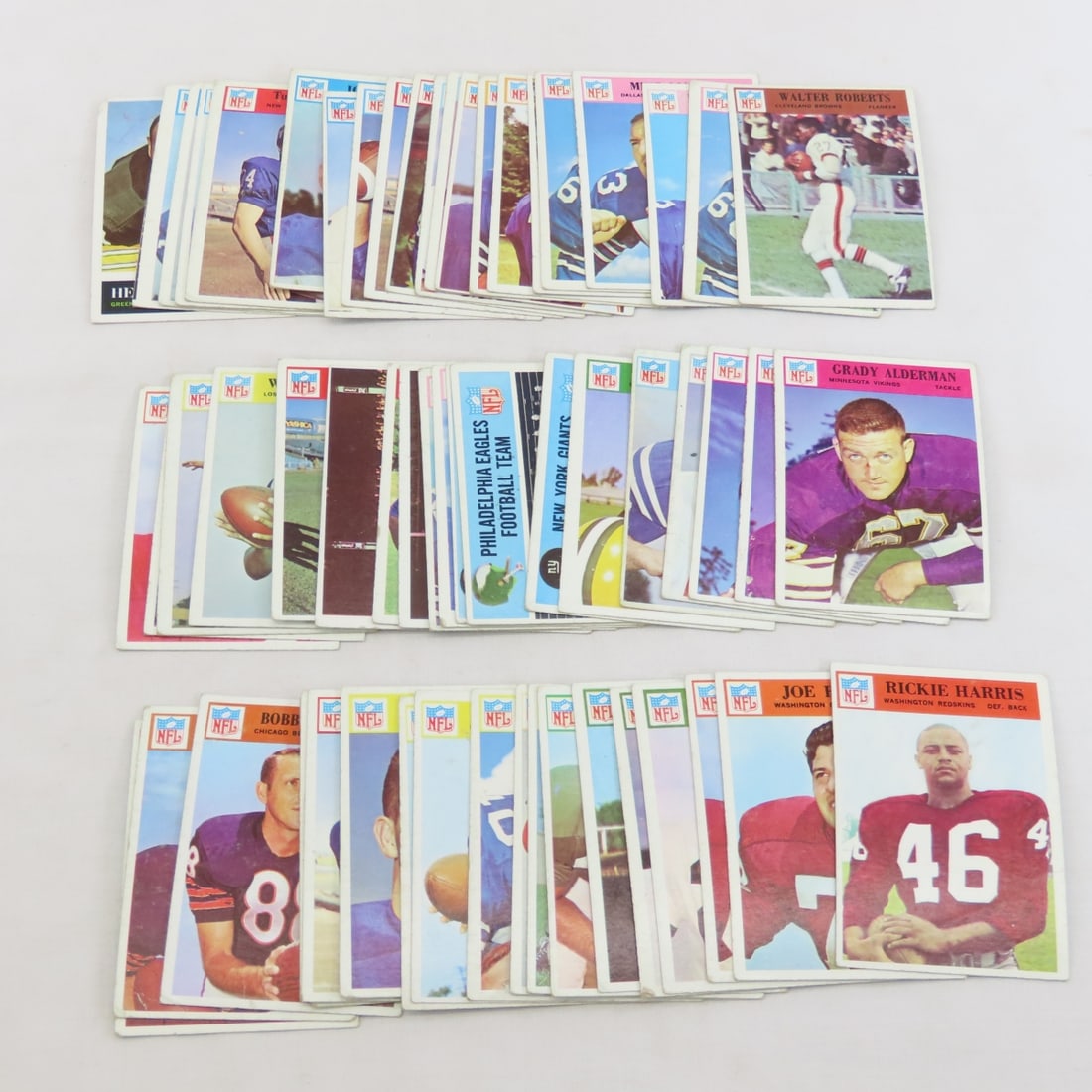 55+ 1966 Philadelphia Football Cards: 55+ 1966 Philadelphia Football Cards - LOT SIZE 4X4X4" 1 LB Photos are part of description. (Live Auctioneers only shows a max of 20 photos). Please ask questions and read terms & conditions before bi